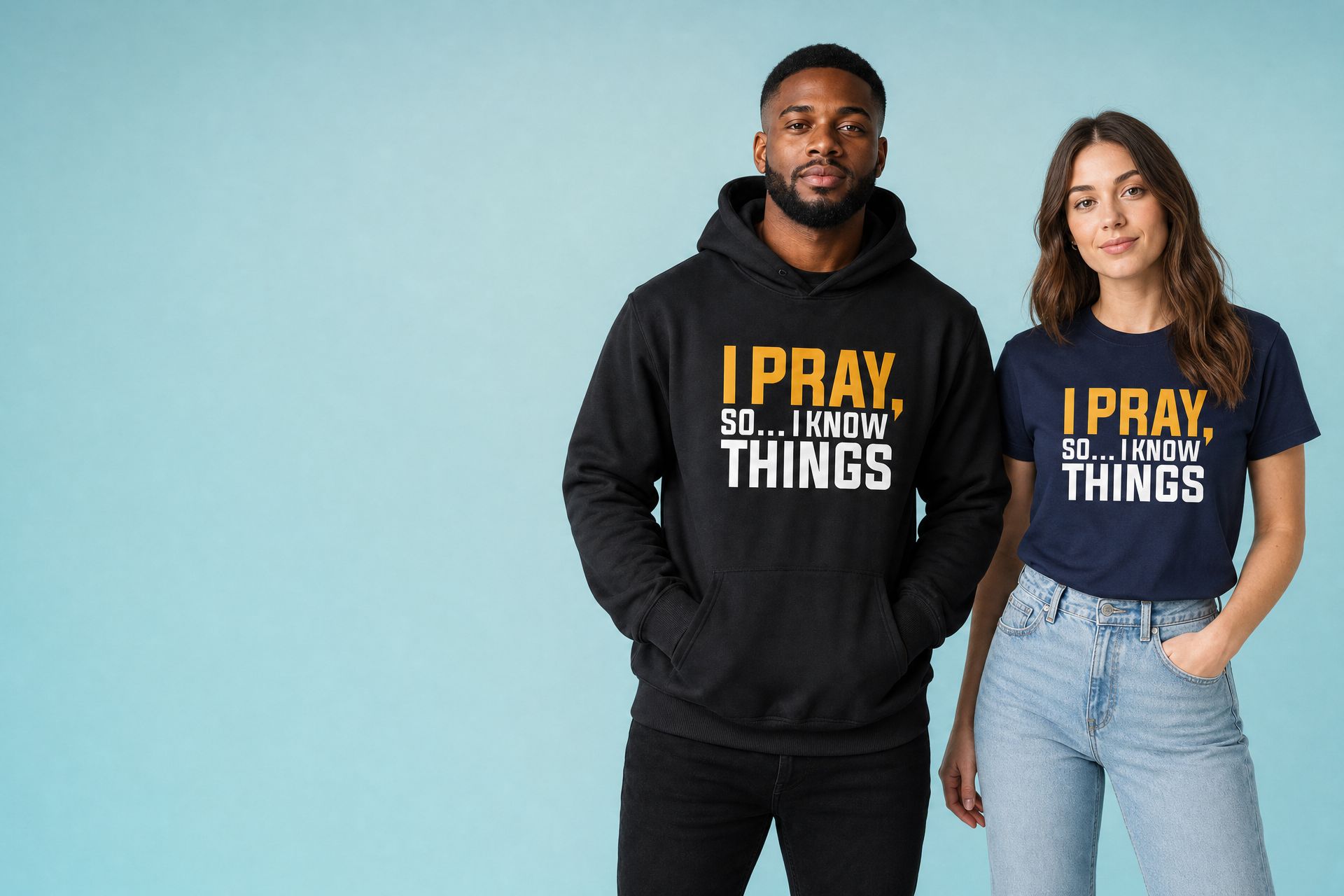 Man in the black I Pray Limited Edition hoodie and woman in the navy I Pray tee