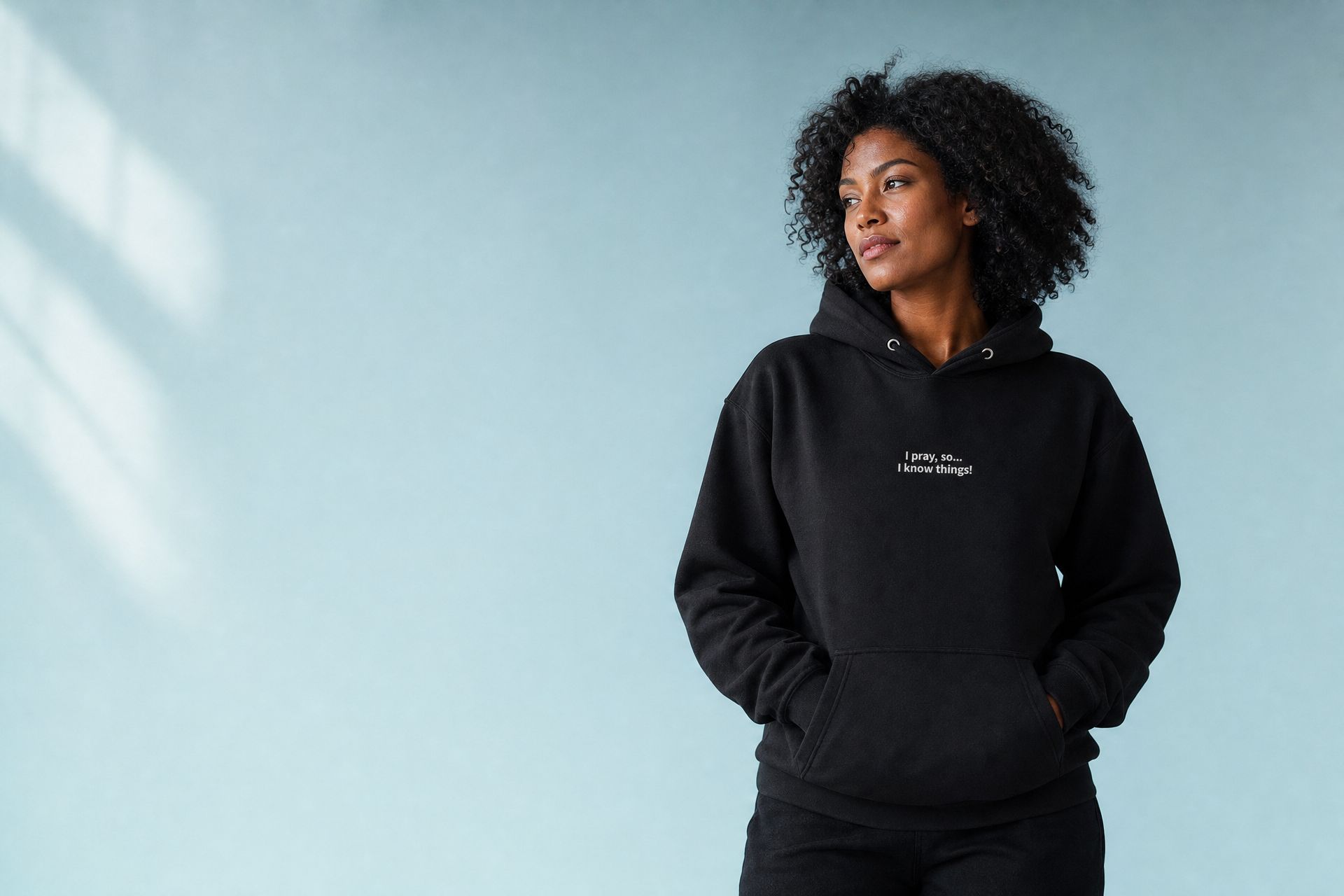 Woman in the black Minimalist I Pray hoodie