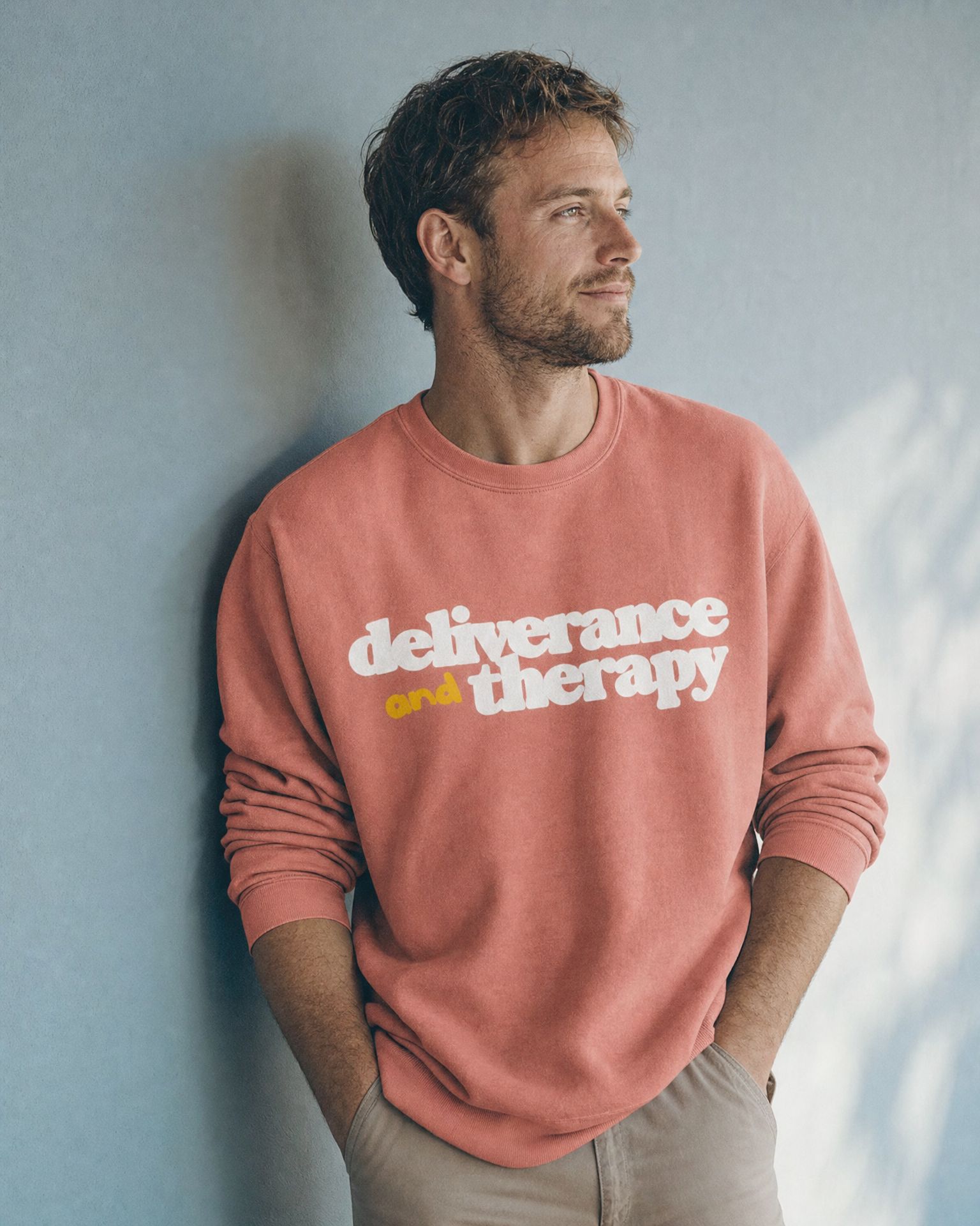 Man in the D+T Bubble crewneck in dusty rose